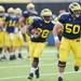 Michigan sophomore running back Fitzgerald Toussaint runs the ball behind senior offensive lineman David Molk during a play at practice on Tuesday.  Melanie Maxwell I AnnArbor.com
